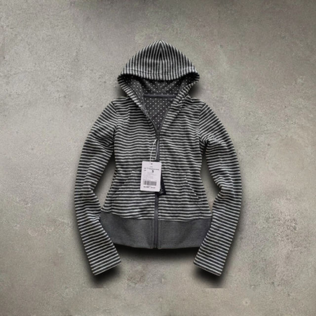 Grey striped hoodie with a hang tag on the same background